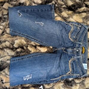 Amber embellished jeans. Stud detail with turquoise and thick stitch pocket.